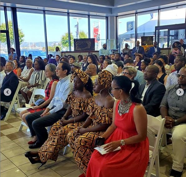 A group of people sitting in chairs at an event.