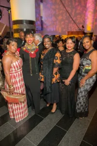 Five stylish women posing at glamorous gala